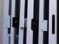 White screen door frames with black locks