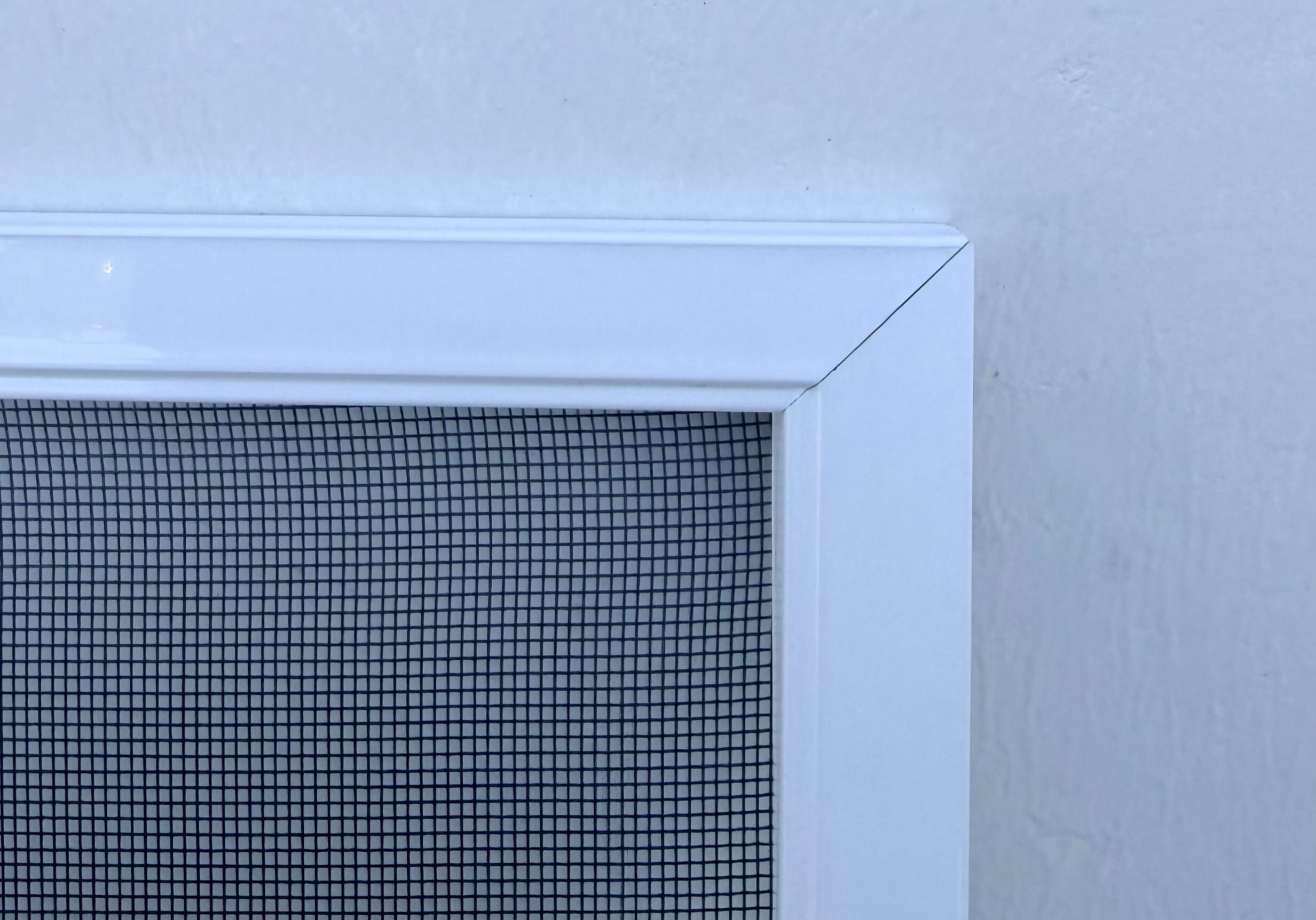 Close-up of mesh insect screen frame